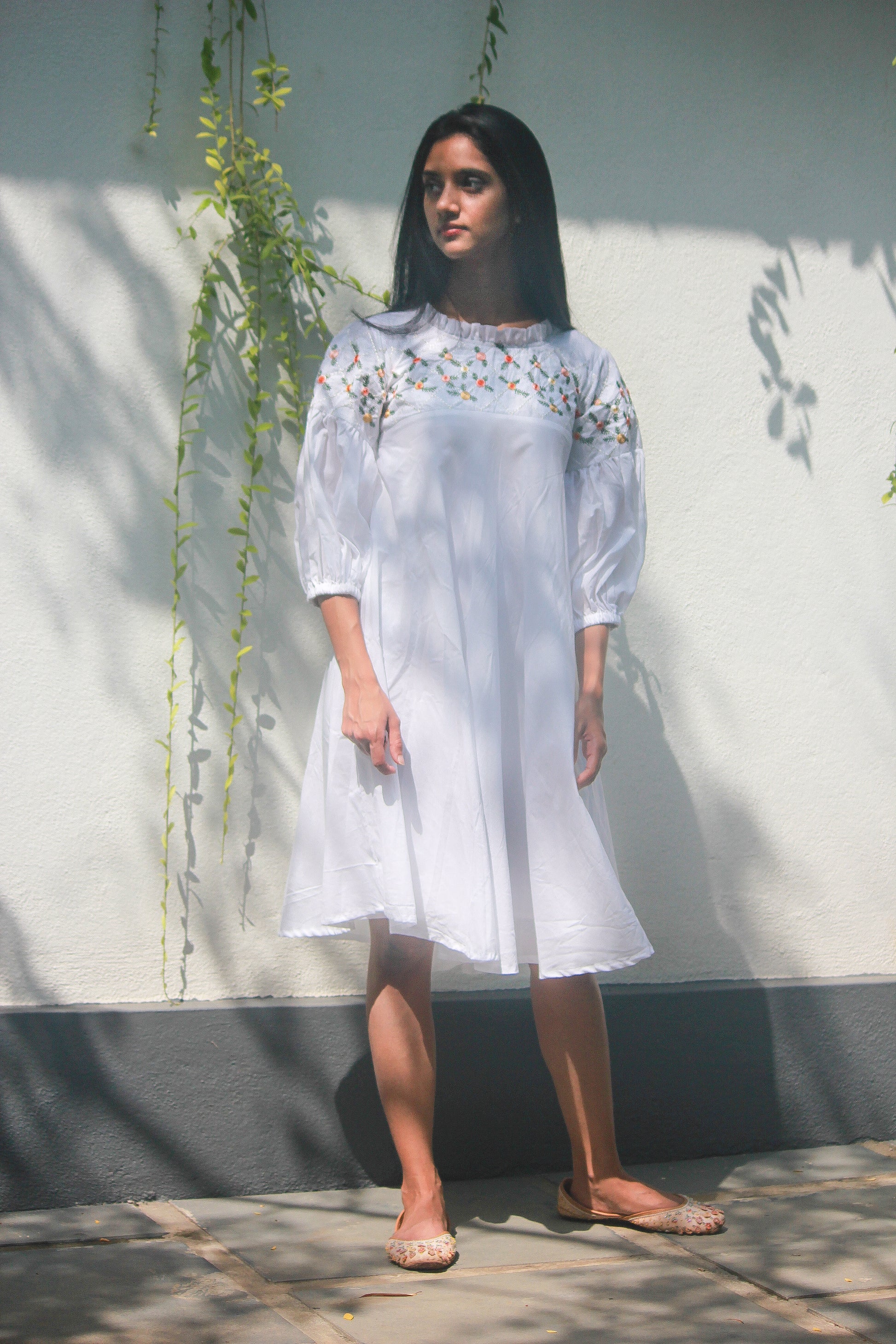 100% cotton dress in white colour with floral embroidery on the yoke and sleeves