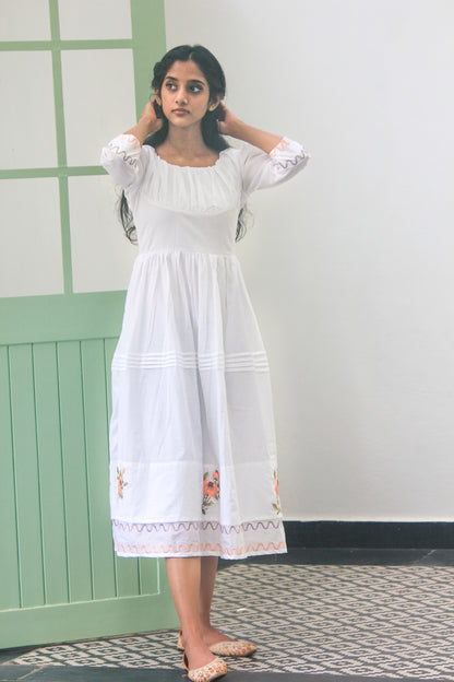 White gathered dress with pintucks and  floral border